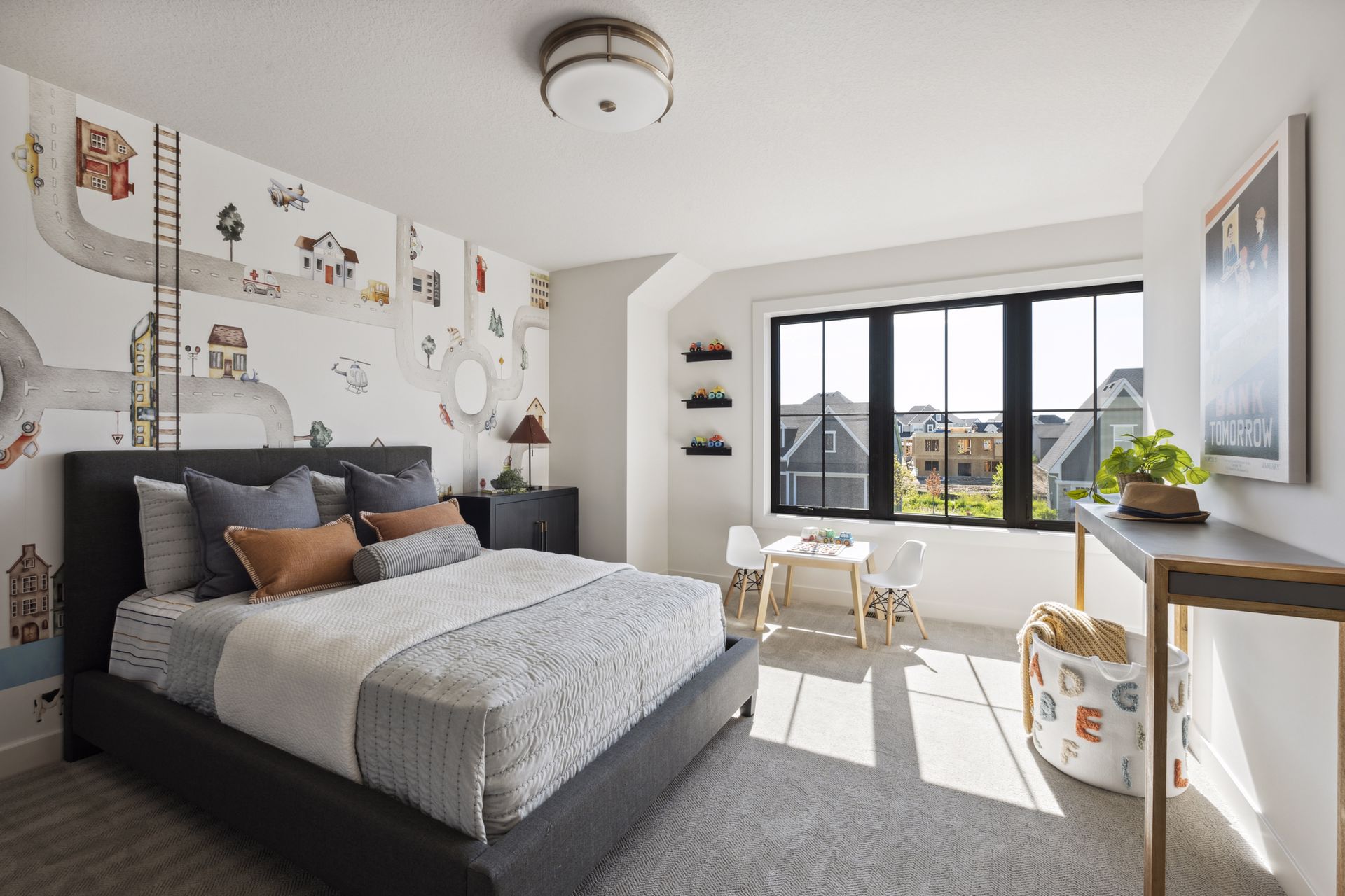http://A%20childs%20bedroom%20with%20a%20wall%20mural%20of%20a%20busy%20city%20streets